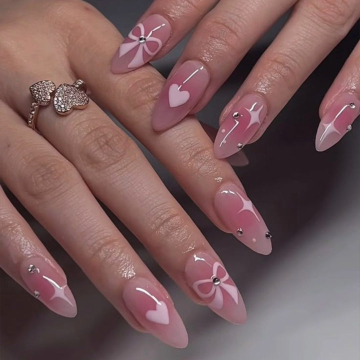 Artistic Heart-Embellished Stiletto Nail Enhancements