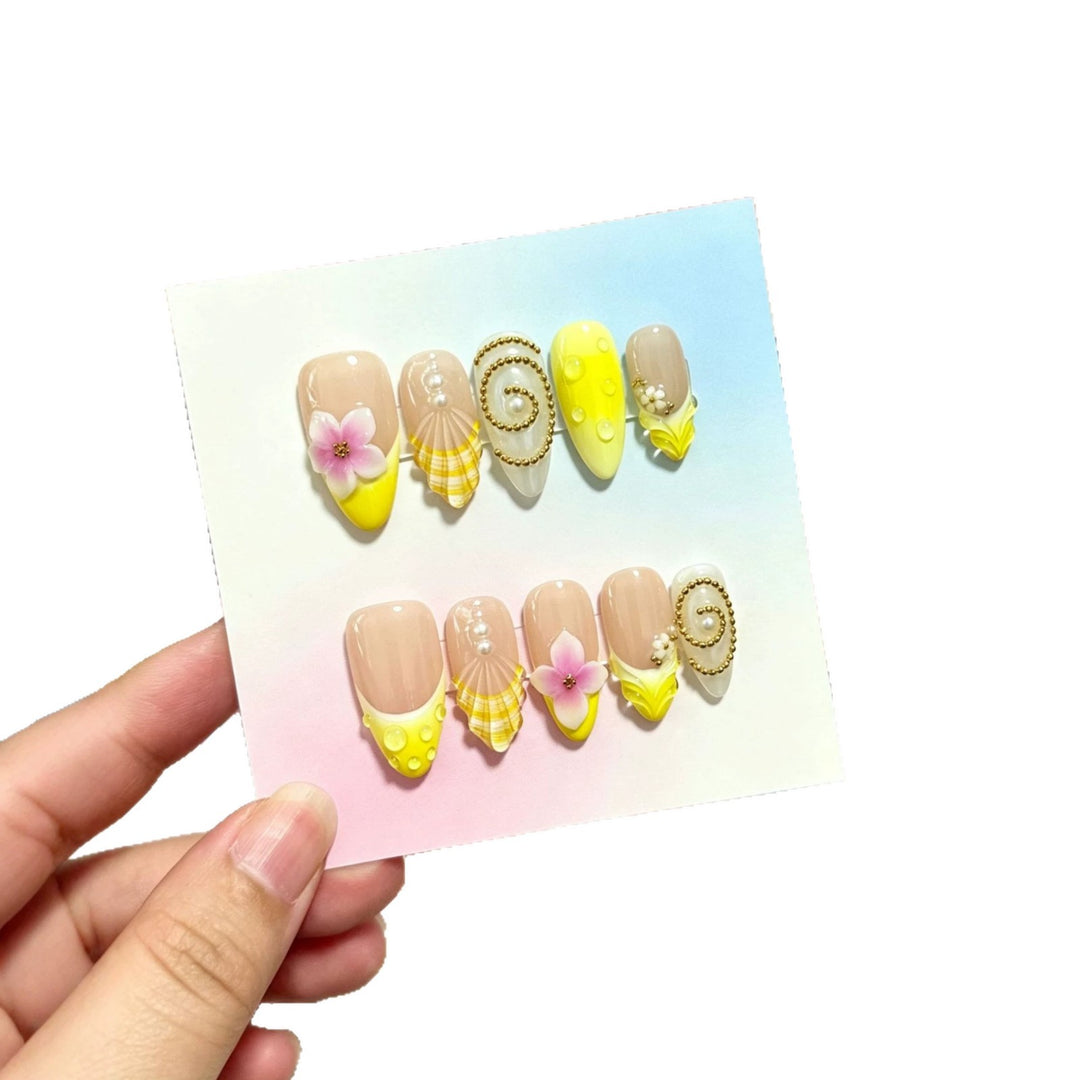 Artistic Press-On Nail Art Set with Floral and Shell Accents