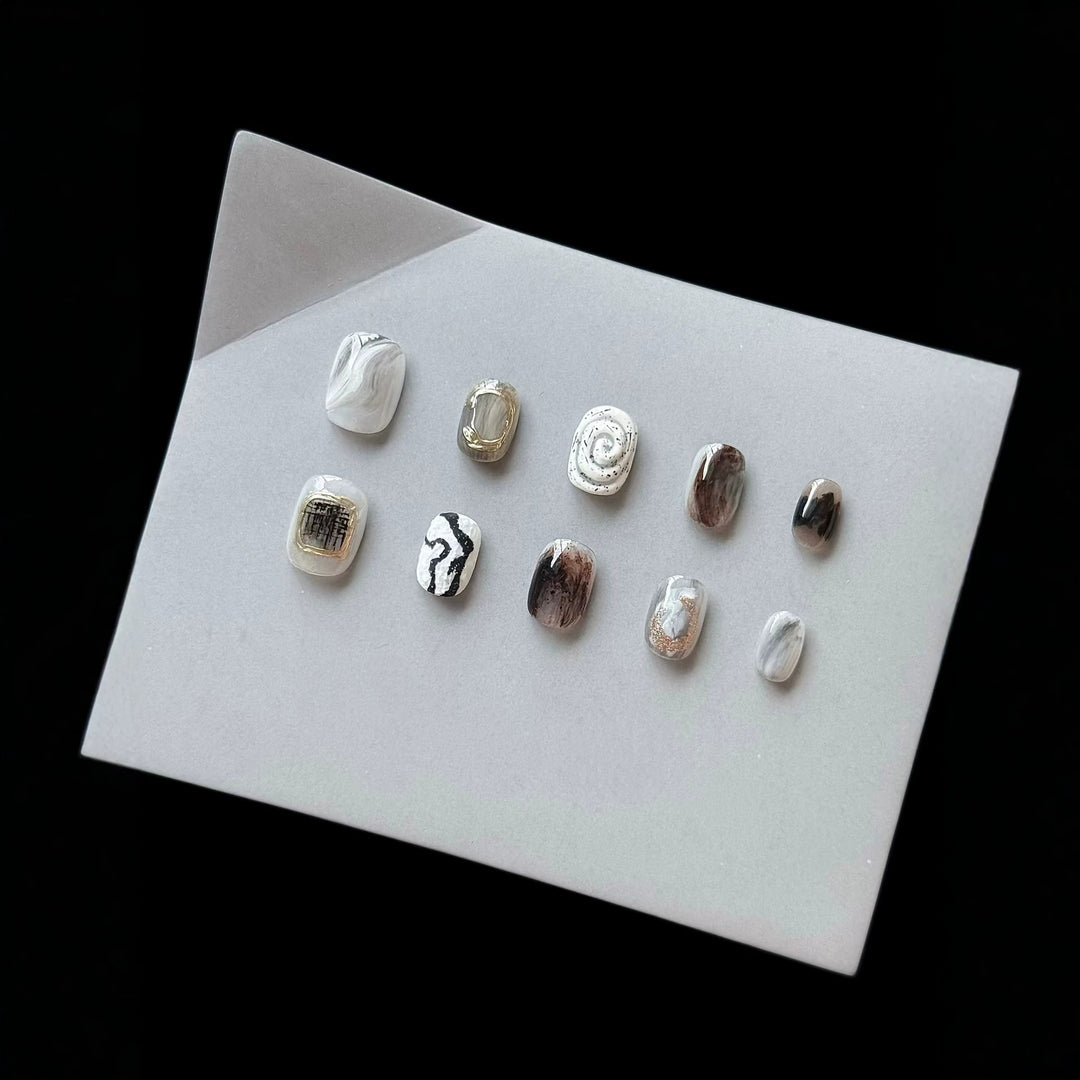 Artistic Press-On Nail Set with Modern Marble and Metallic Accents