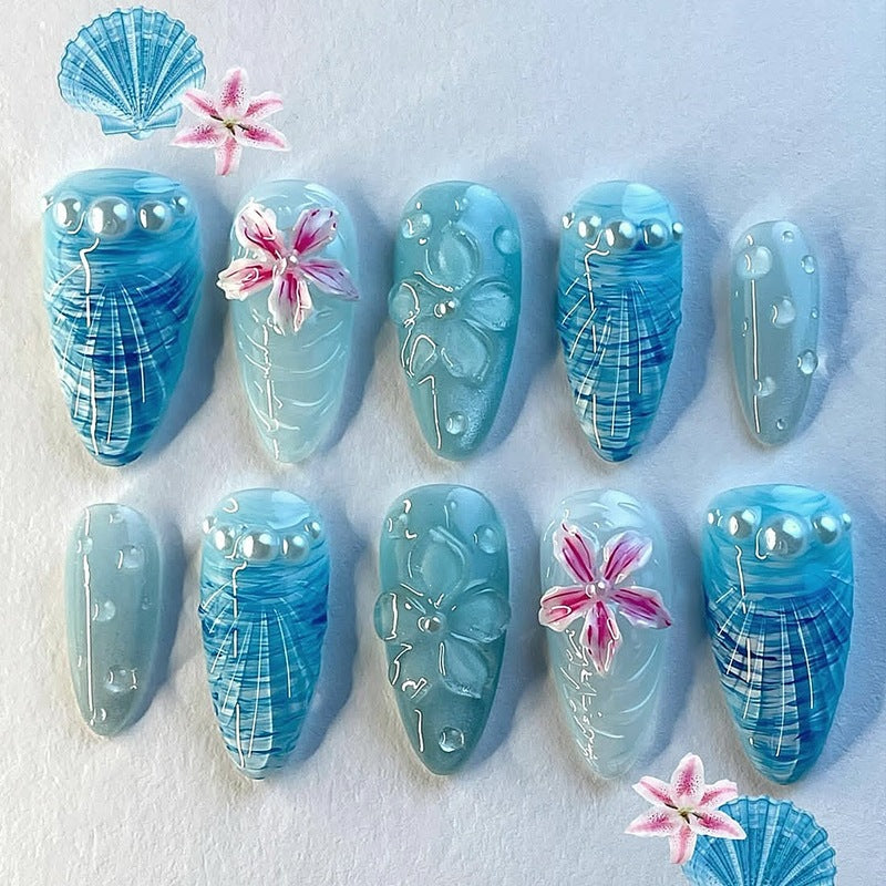 Nail art set with unique aquatic motifs and decorative accents Kalsten