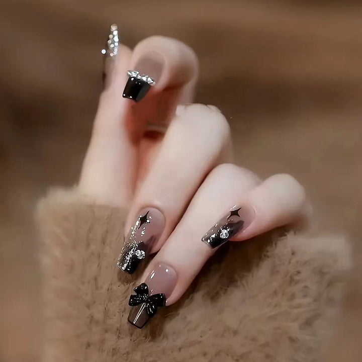Glamorous artificial nails with heart and glitter details Kalsten