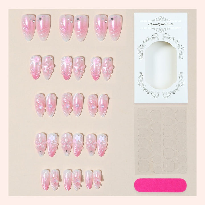 Acrylic nail set with elegant flower design and glitter accents Kalsten