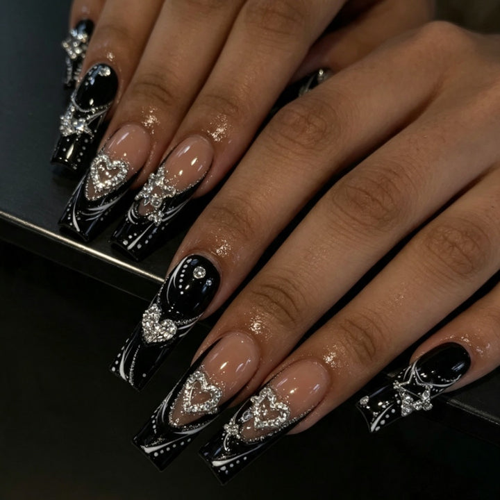 Artificial nails with elegant glitter accents and heart motifs Kalsten