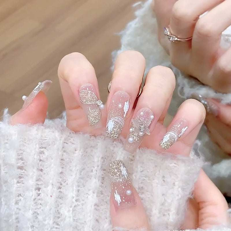 Glamorous artificial nails with heart-shaped accents Kalsten