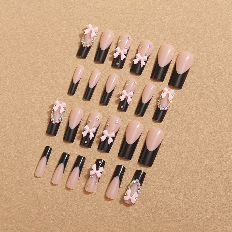 Artificial nails with elegant bows and rhinestone embellishments Kalsten