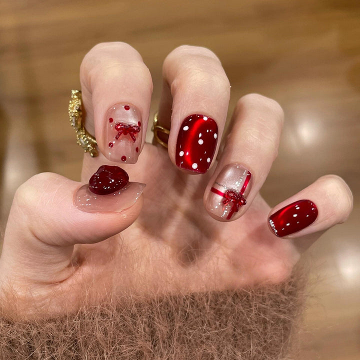 Artificial nails with festive gift design Kalsten