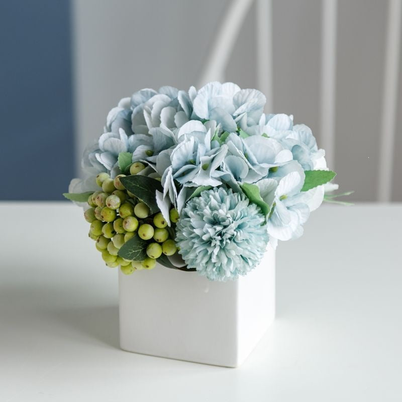Lifelike Floral Arrangement in Decorative Square Planter