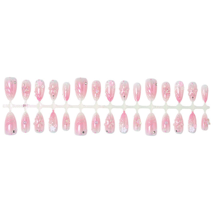 Acrylic nail set with elegant flower design and glitter accents Kalsten