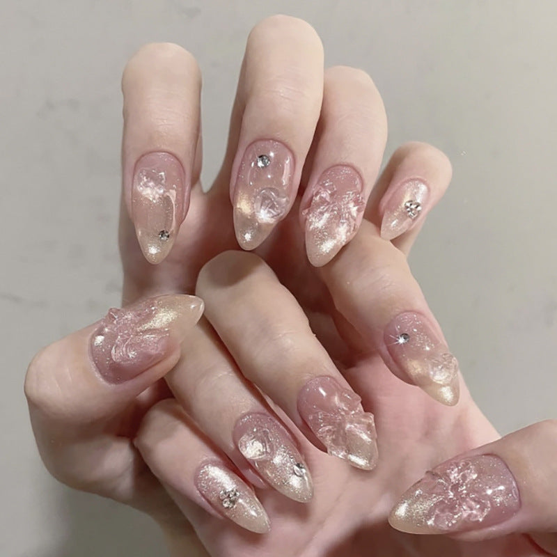 Artful stiletto nails with floral design and glitter accents Kalsten