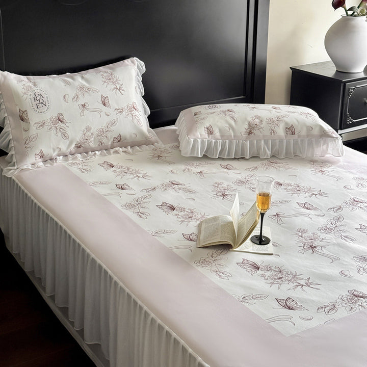 Bedding set with ruffled bed skirt, floral printed center piece and frill pillow