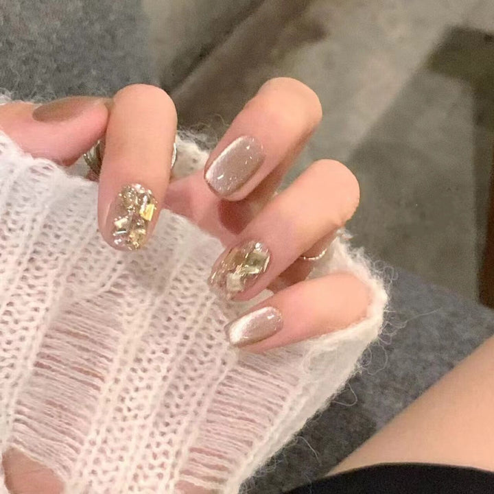 Artificial nail set with elegant glitter pattern and golden accents Kalsten