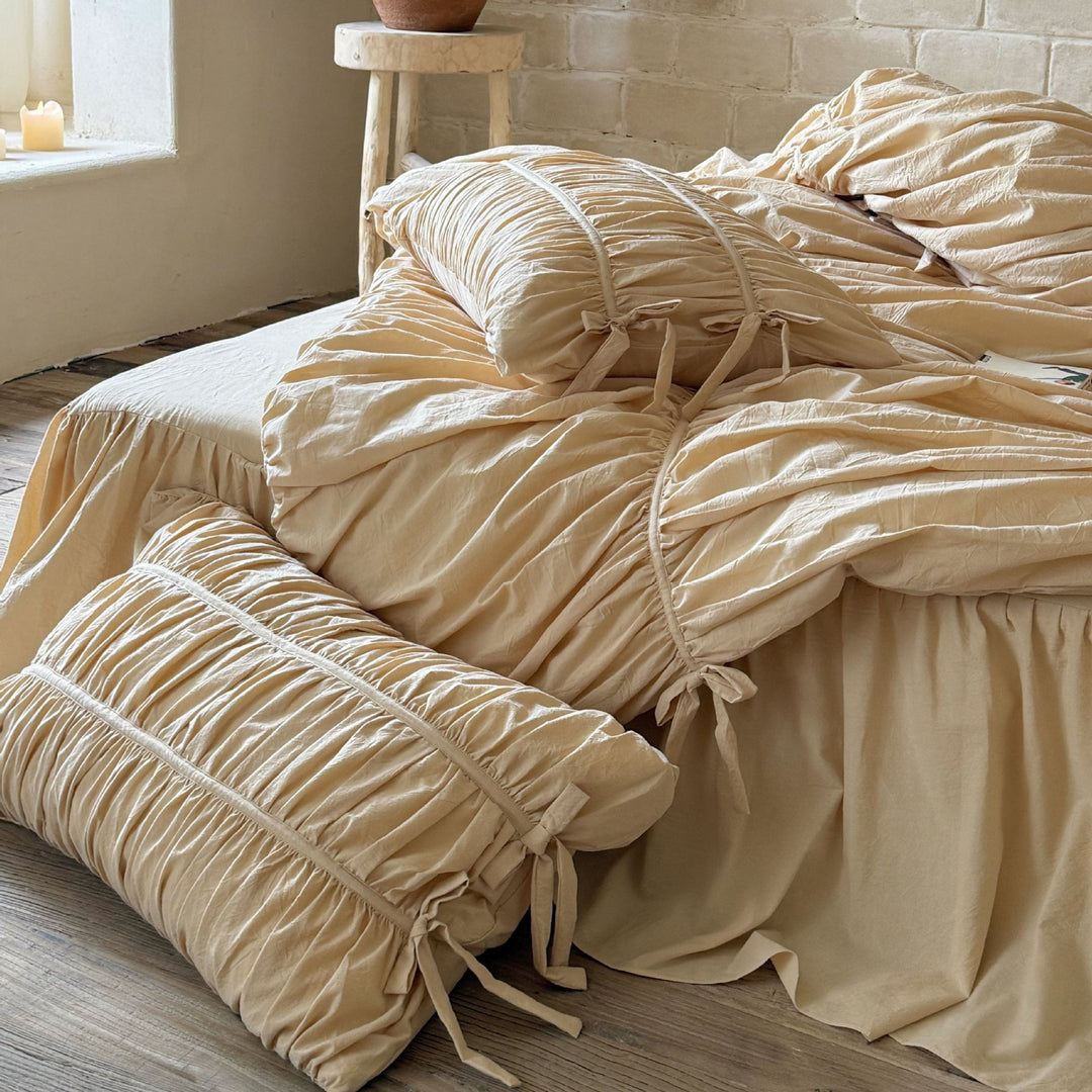Luxurious gathered bedding set with ruffle, frills, and ties