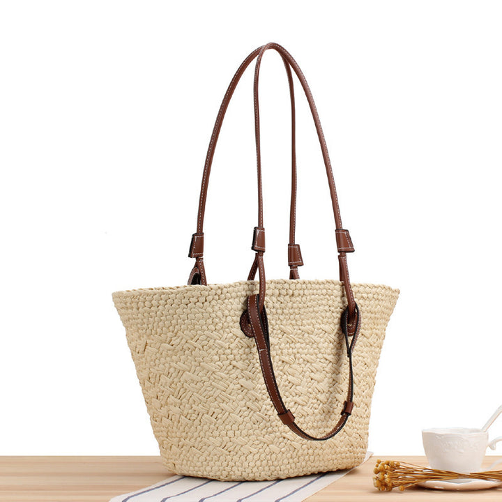 Beach bag made of handcrafted natural material with sturdy leather handle Kalsten