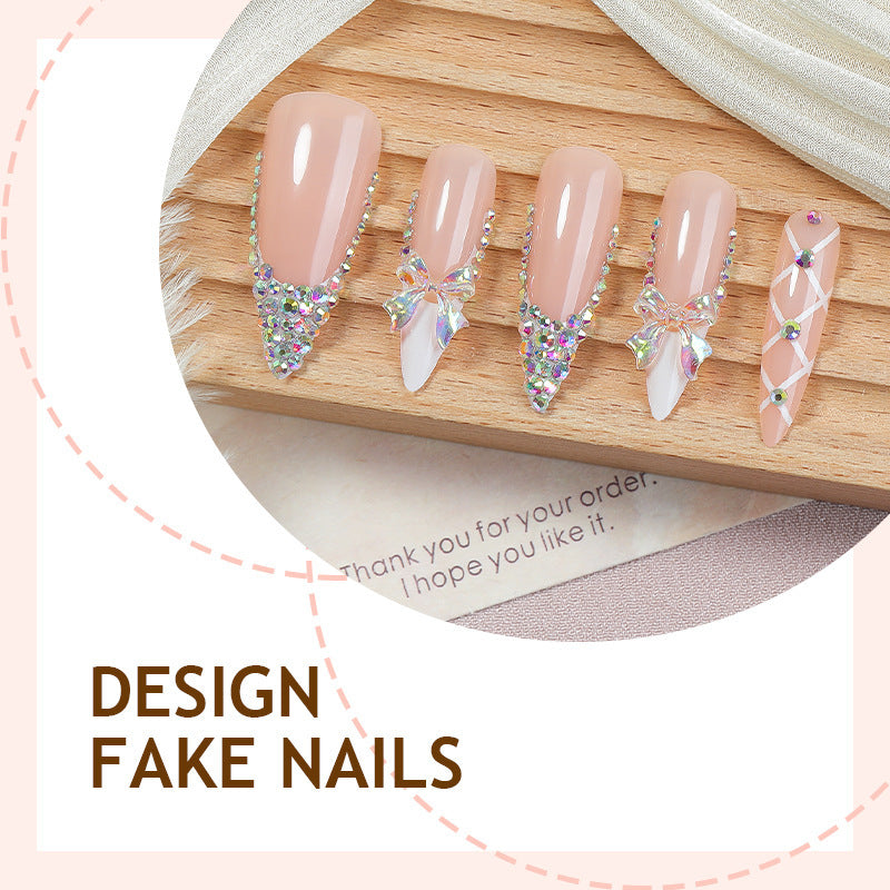Acrylic nail set with luxurious rhinestone embellishments and bow accents Kalsten