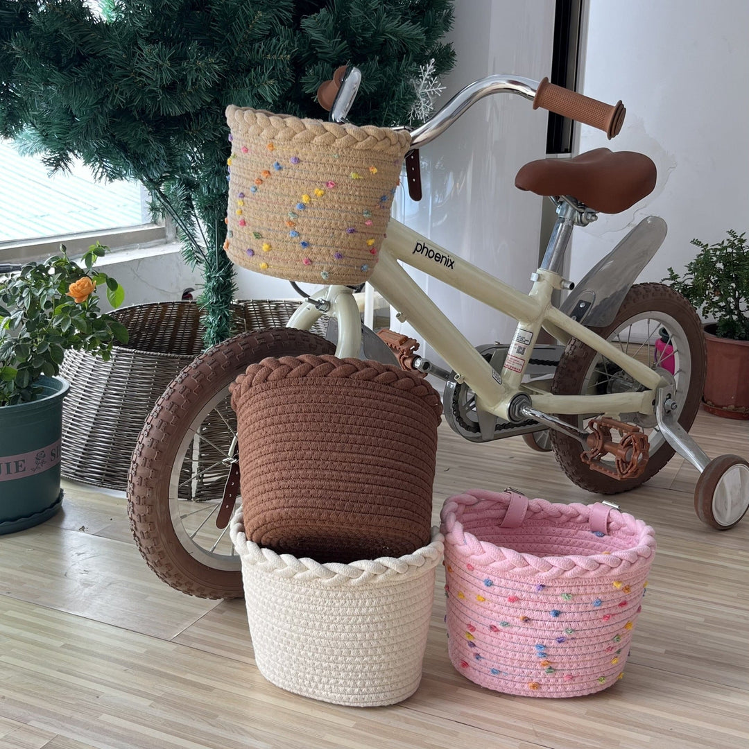 braided rope bike basket with pom pom embellishments and leather handlebar straps Kalsten