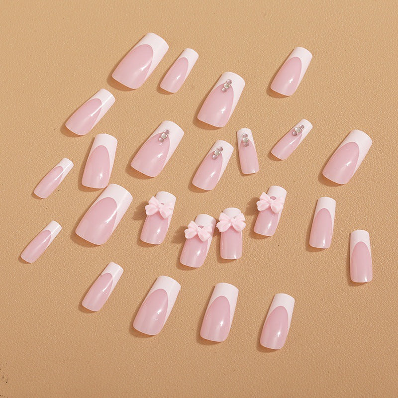 Trendy French-design artificial nails with bow accents Kalsten