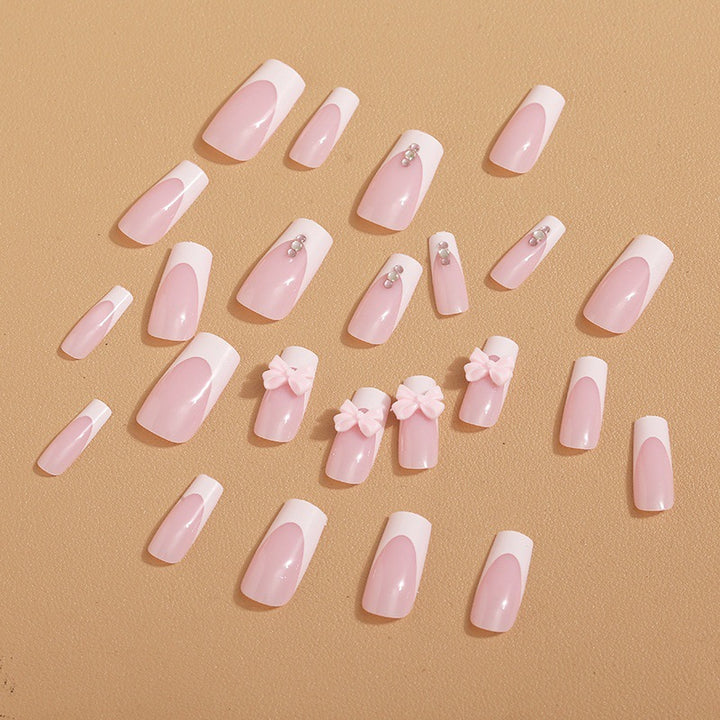 Trendy French-design artificial nails with bow accents Kalsten