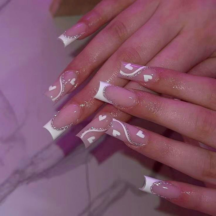 Artificial nail set with romantic heart design and glitter accents Kalsten