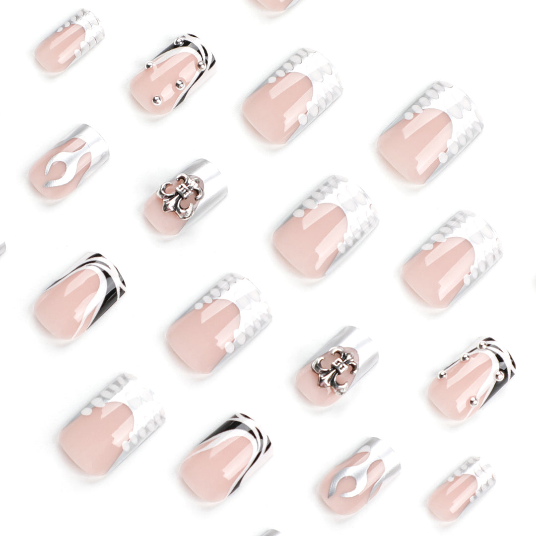 Artistic nail extensions with metallic embellishments Kalsten