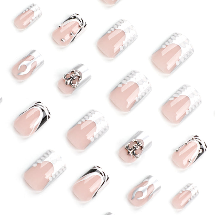 Artistic nail extensions with metallic embellishments Kalsten