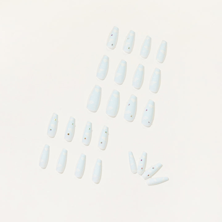 Creative nail art in cloud design with glitter accents Kalsten