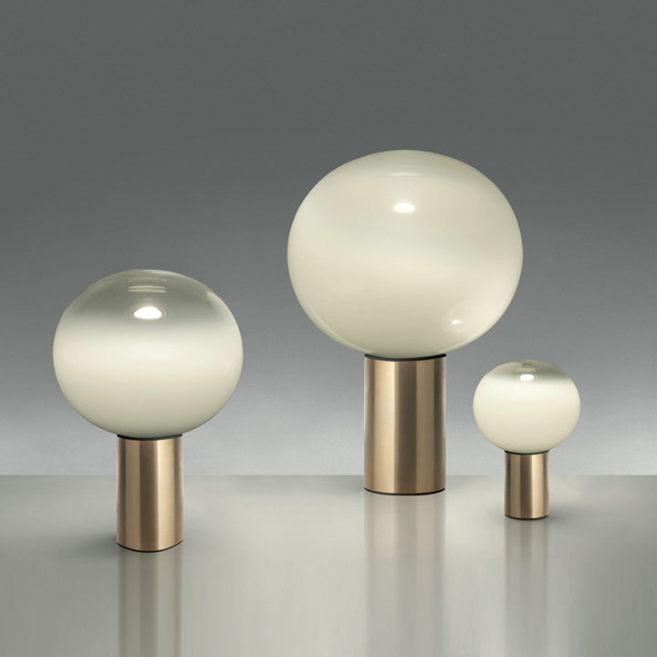 Modern Artistic Table Lamp with Sleek Metallic Base and Globe Shade