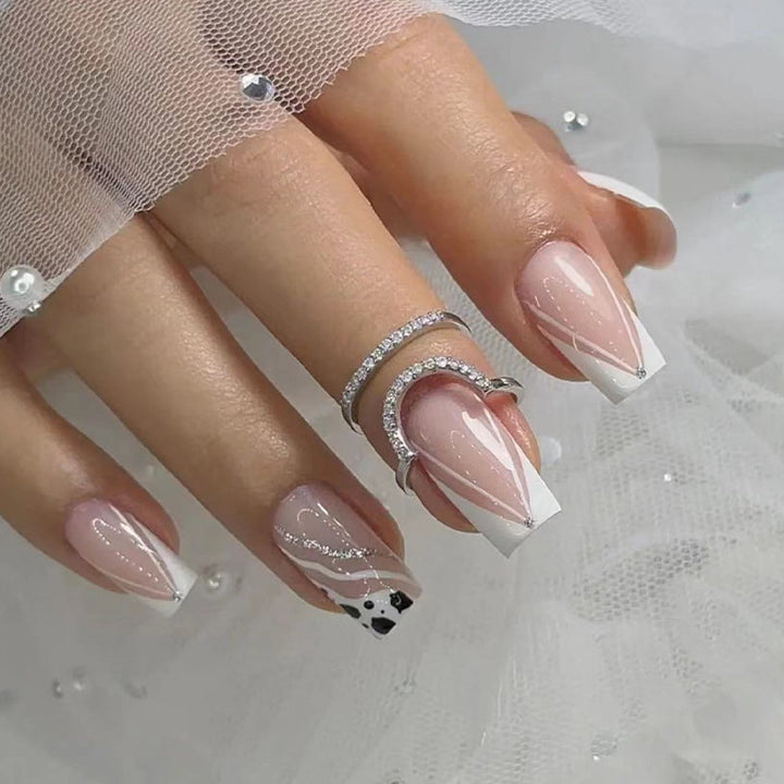 Artificial nails with elegant French design and glitter details Kalsten