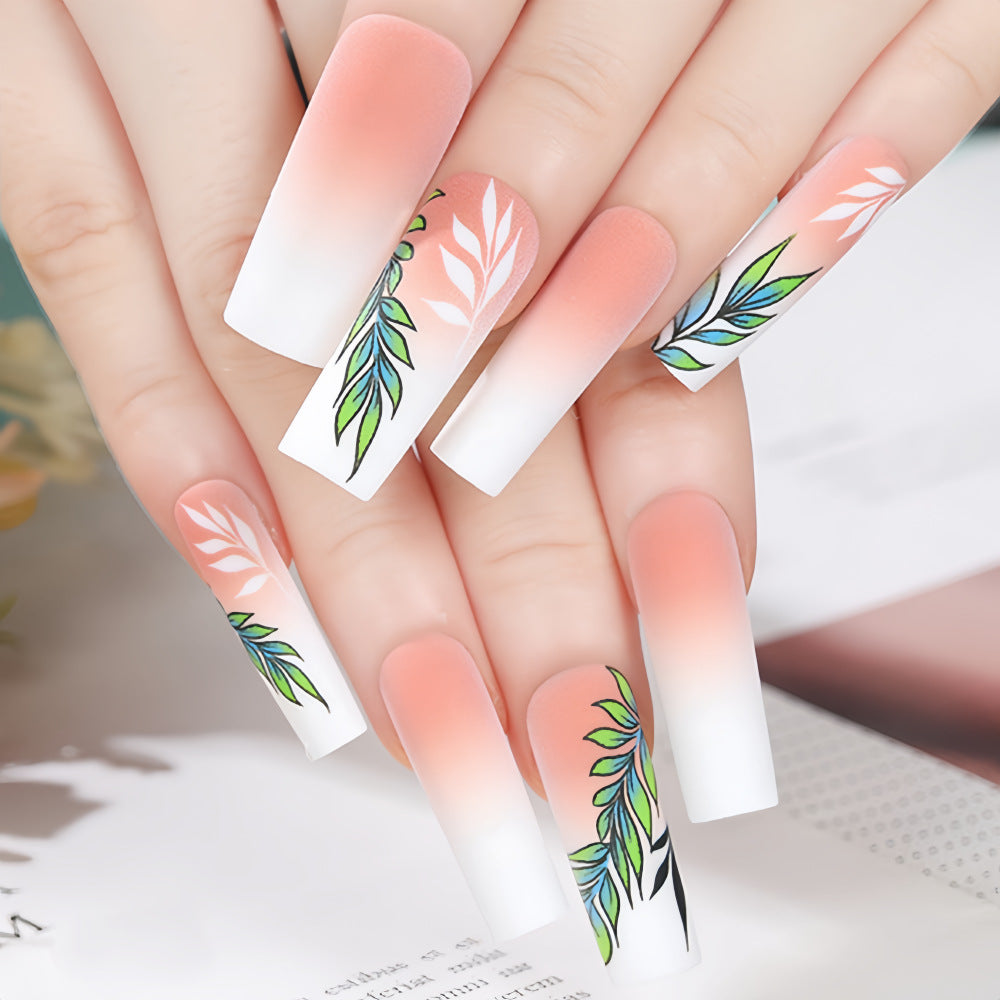 Artificial nails with elegant ombre design and floral accents Kalsten