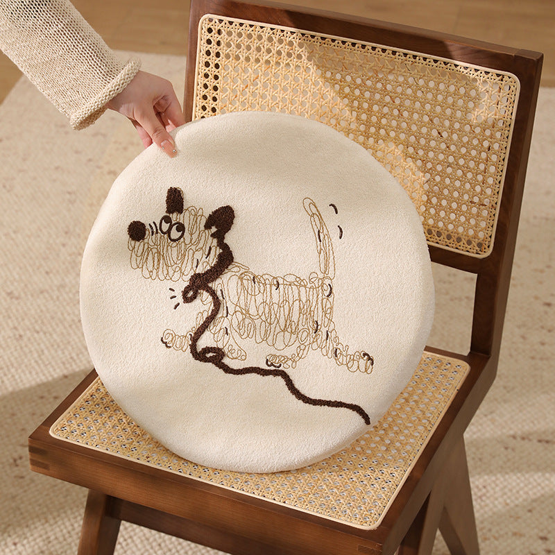 Round padded seat cushion with embroidered cat motif
