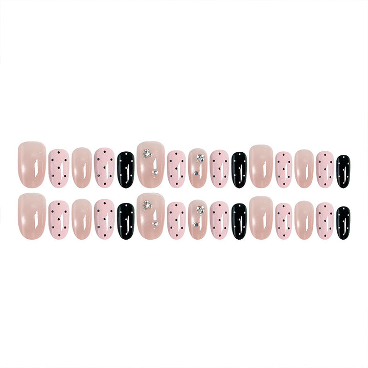 Acrylic nail set with glamorous rhinestone accents and modern dots Kalsten