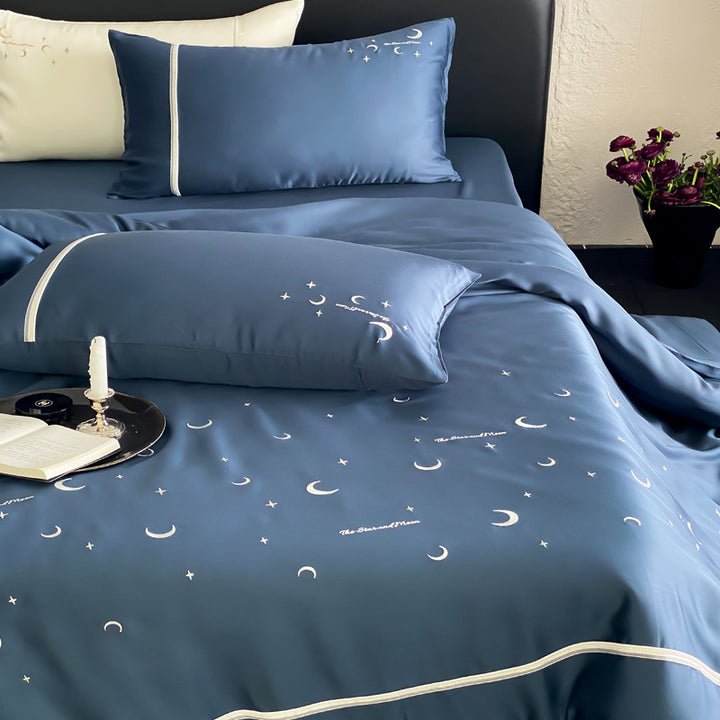 Silky shiny satin bed linen set with subtle moon and star motif