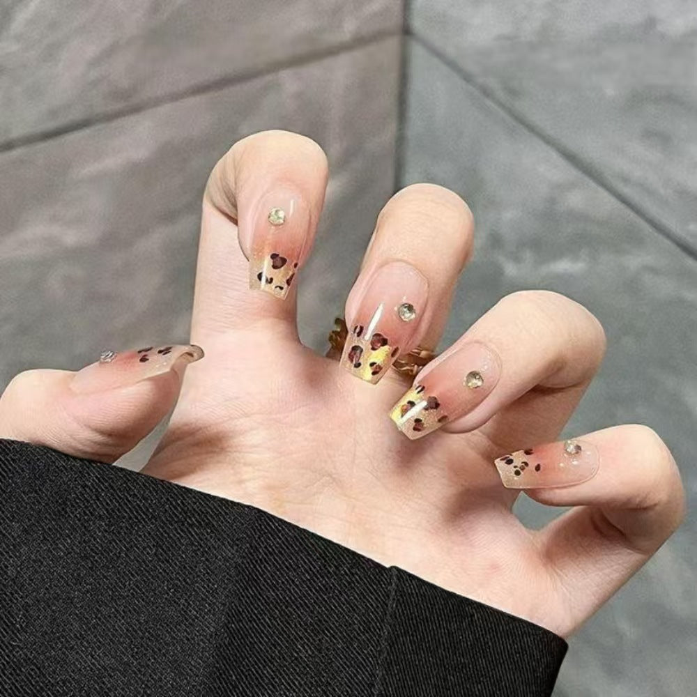 Artificial nails with elegant leopard pattern and glitter accents Kalsten