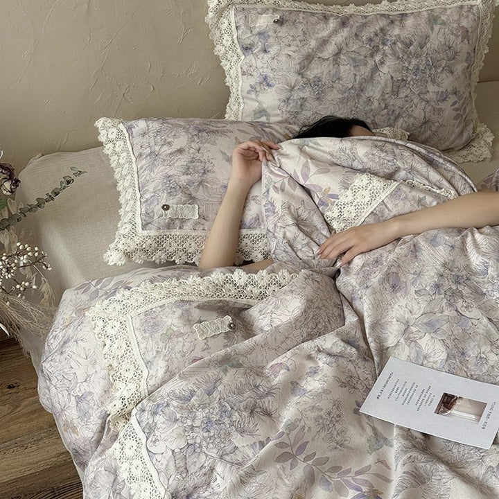 Duvet cover set made of cotton percale with fine lace trim and botanical watercolor pattern