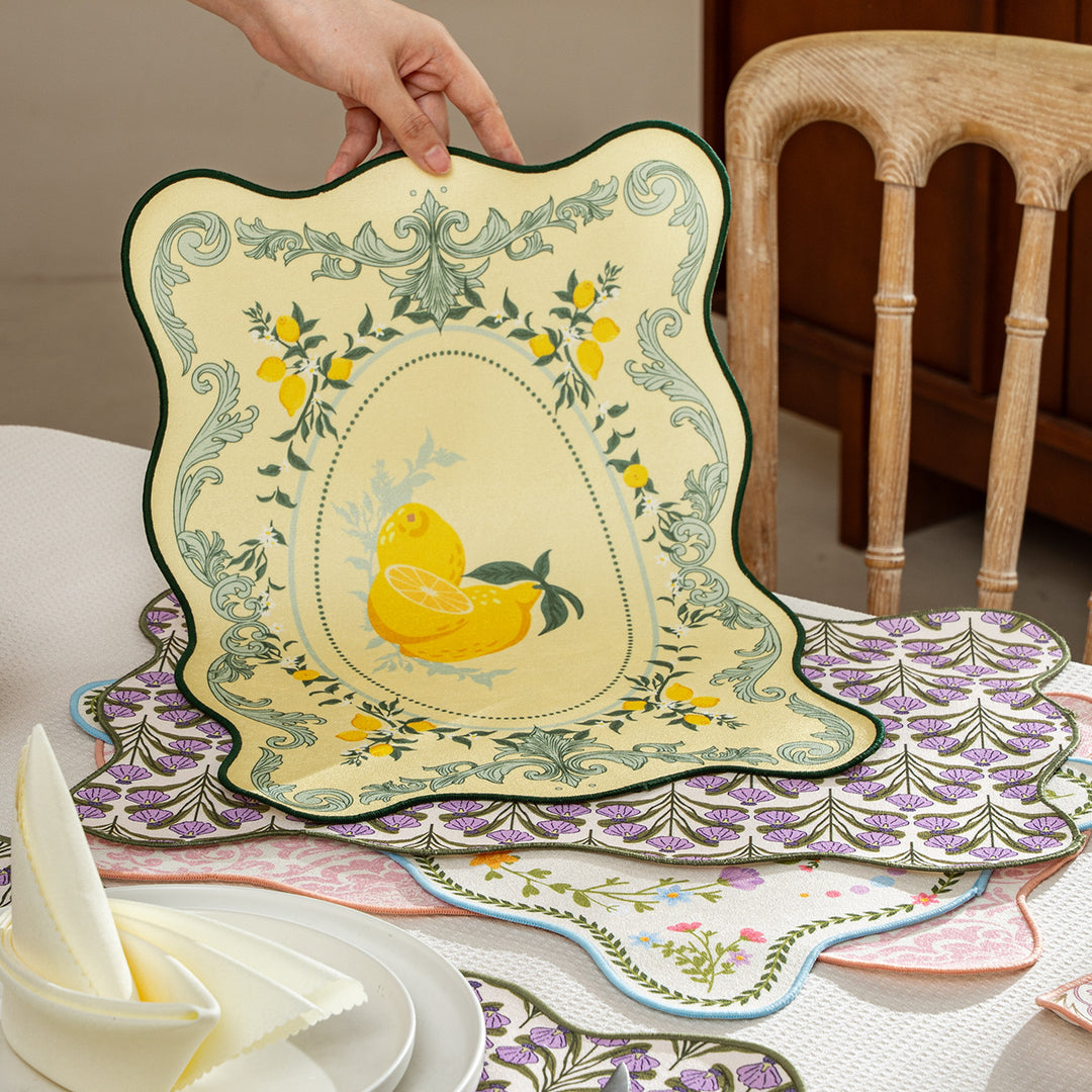 Shaped placemat made of cotton blend with pomegranate and parrot motif