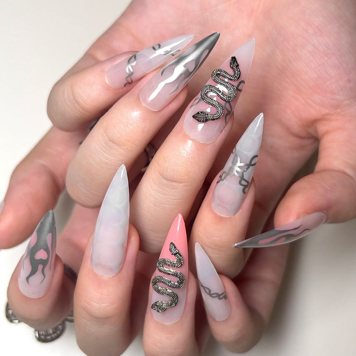 Artistic stiletto nails with snake motif Kalsten
