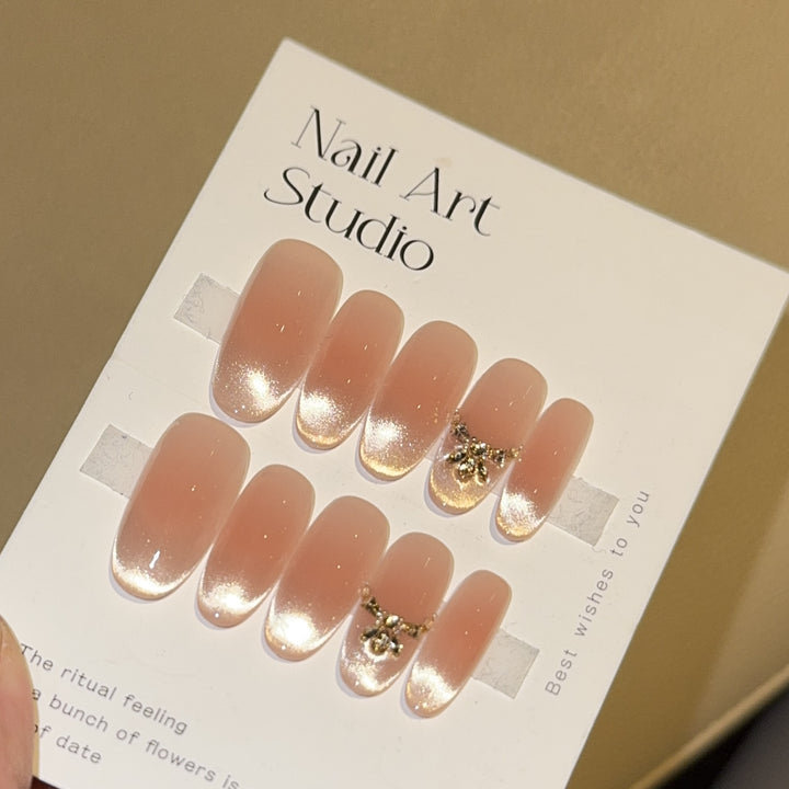 Artificial nails with elegant tip design and gold accents Kalsten