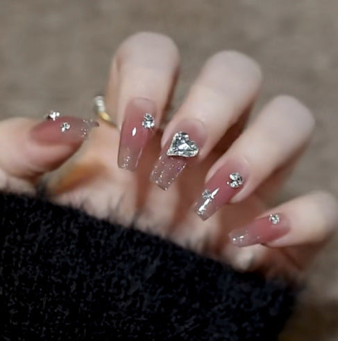 Artistic Nail Art with Glitter and Flower Applications Kalsten