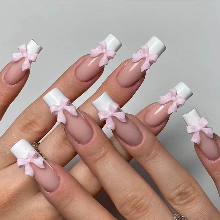 Artificial nails with playful bow design Kalsten