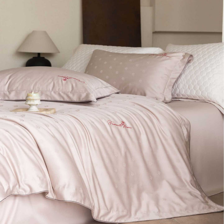 Luxurious satin bedding complete set with quilted cover and delicate logo embroidery