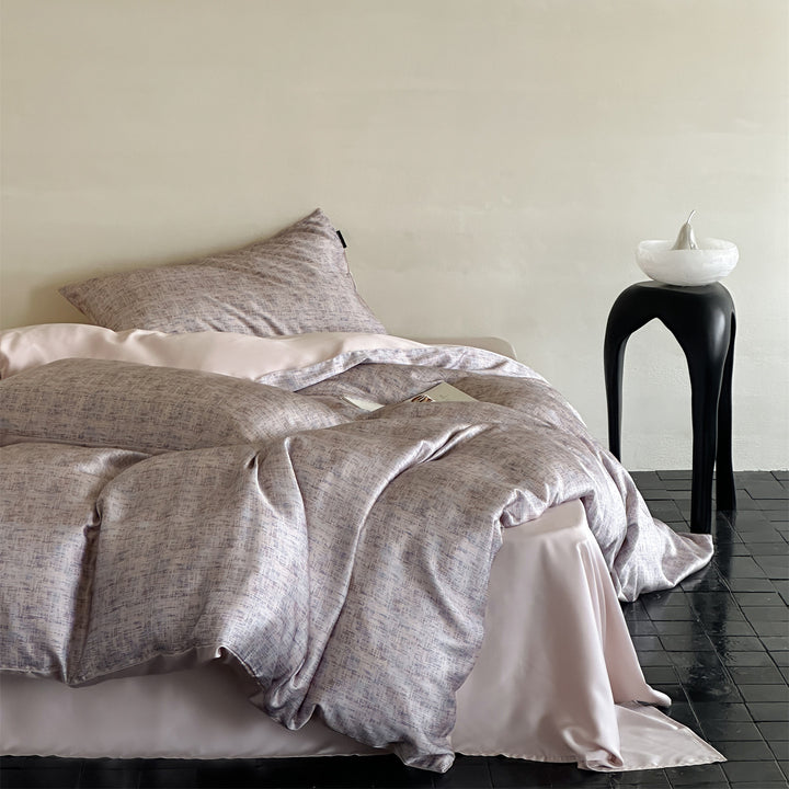 Luxurious satin bedding set with floral watercolor print, ruffled edges and reversible function
