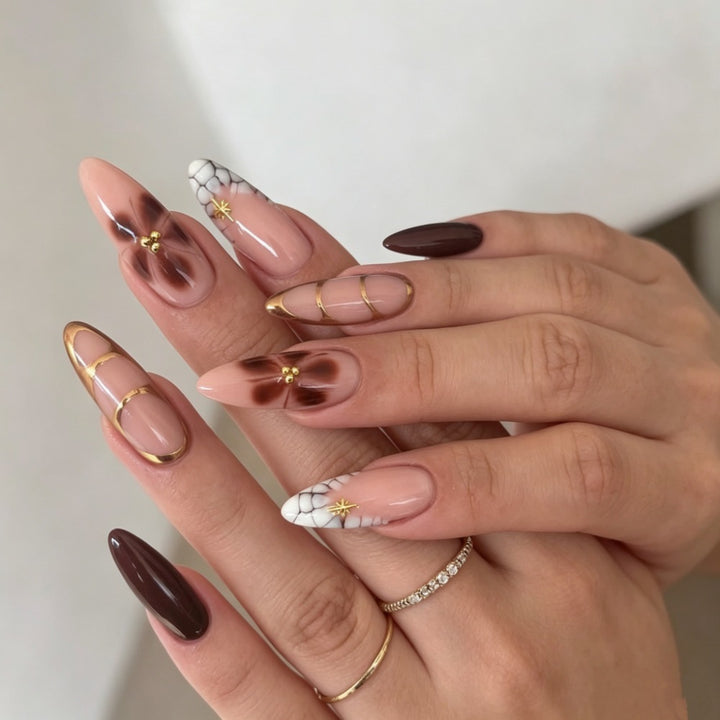Artificial nails with elegant marble pattern and delicate accents Kalsten