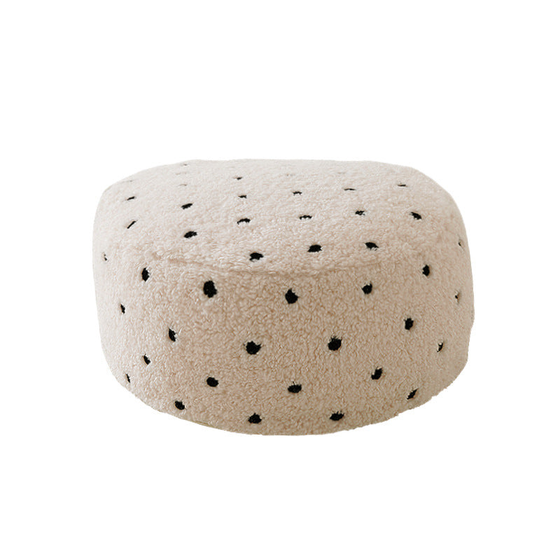 fluffy cylindrical winter hat made of teddy fleece with decorative hole pattern