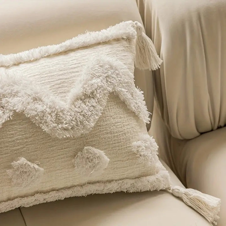 Rectangular decorative cushion cover with hand-tufted chevron and pompom relief as well as corner tassels Kalsten