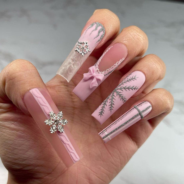 Artful nail extensions with festive decorations Kalsten