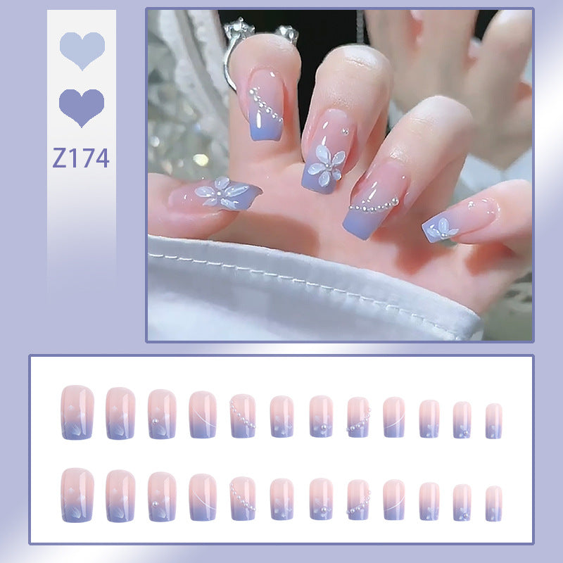Nail set with elegant floral accents and glitter embellishments Kalsten