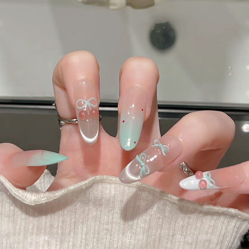 Artificial nail set with elegant bow and cherry designs Kalsten