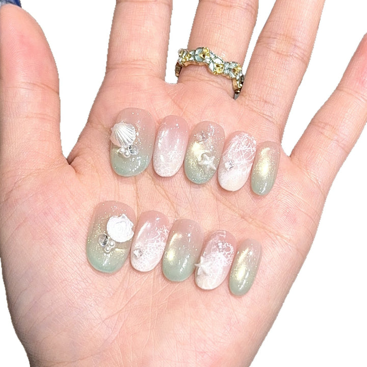 Artificial nail tips with maritime design and glitter effects Kalsten