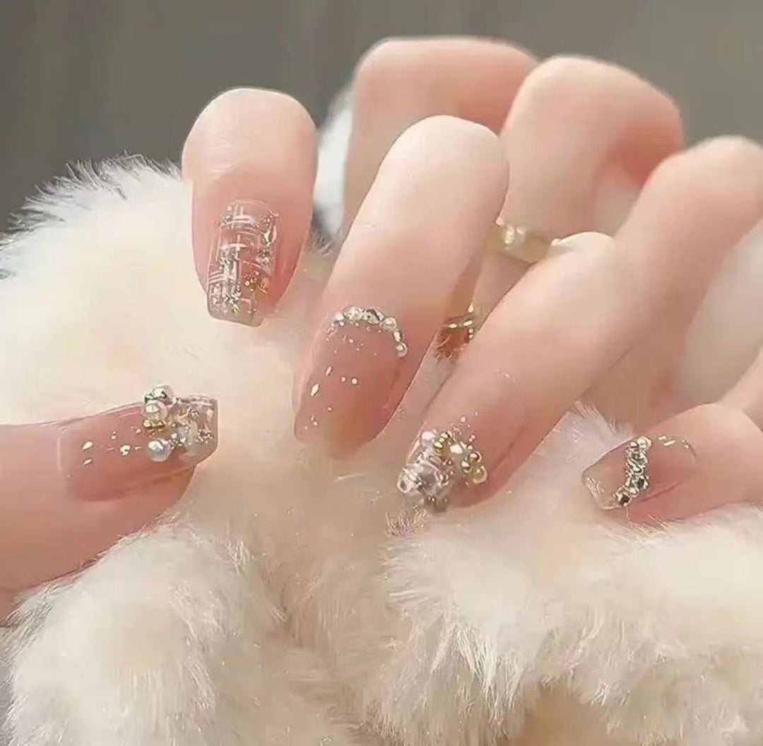 Elegant Nail Art with Glitter and Rhinestones Kalsten