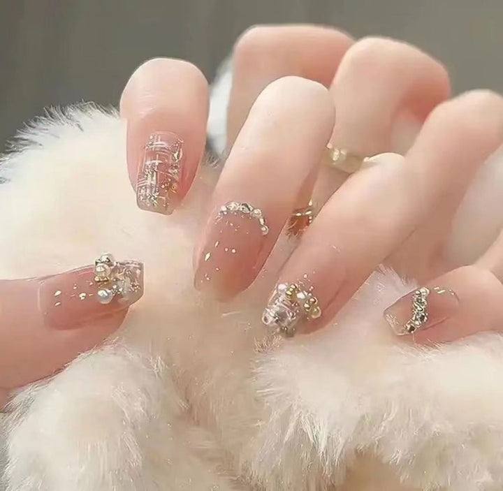 Elegant Nail Art with Glitter and Rhinestones Kalsten