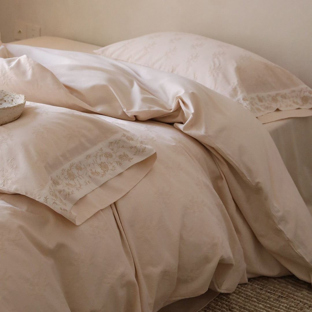 Exclusive cotton satin bedding set with tonal floral jacquard and fine decorative embroidery